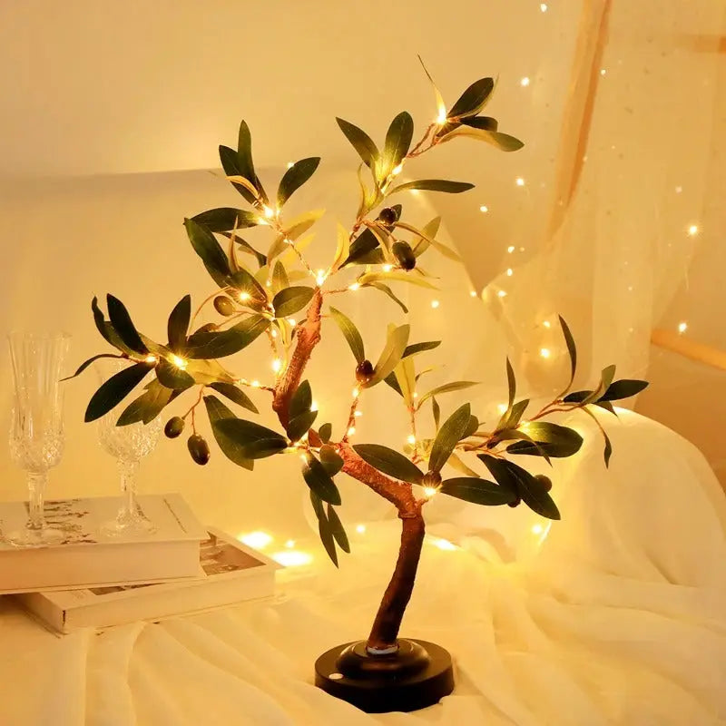 Decorative tree with lights on a table with a warm glow