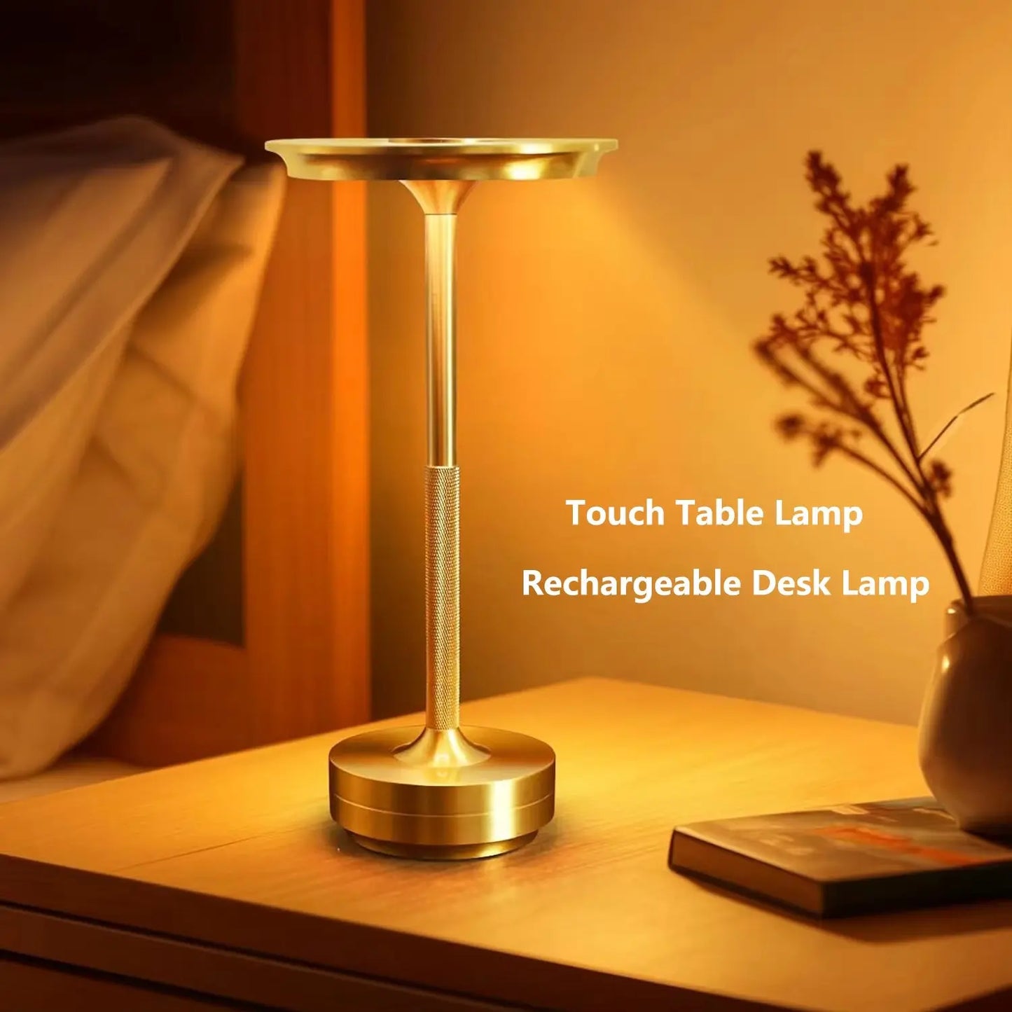 Gold touch table lamp on a bedside table with warm lighting