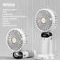 White portable fan with charging cable on a gray background