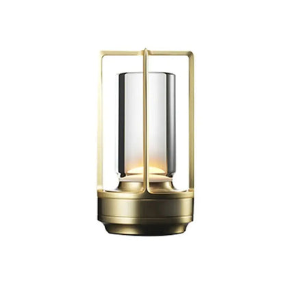 Decorative lamp with gold frame and glass shade on a white background