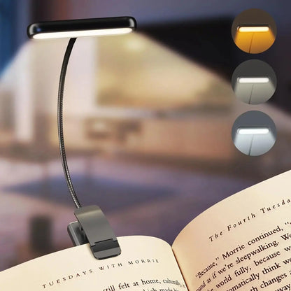 Clip-on book light on an open book with three color options displayed.
