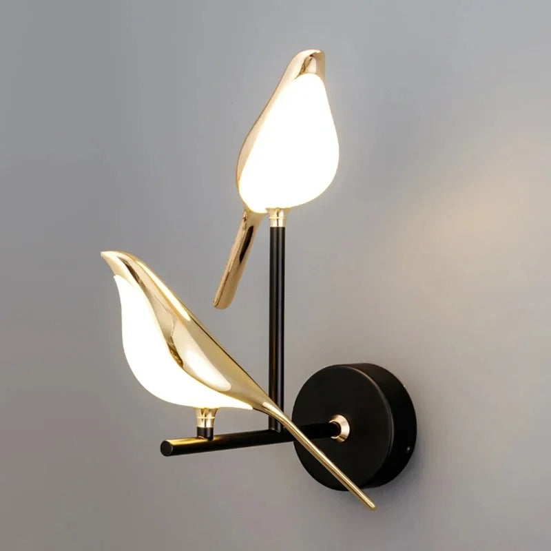 Modern wall lamp with gold leaf-like design on a gray background