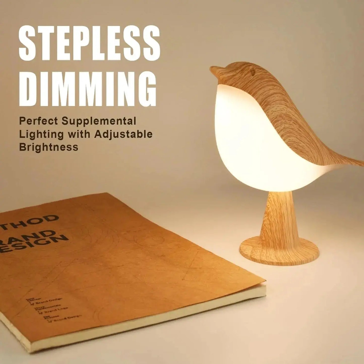 Wooden bird-shaped lamp with stepless dimming feature on a surface next to a book.
