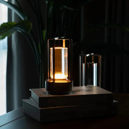 Decorative lamp on a stack of books with a dark background