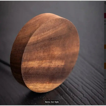 Wooden lamp with a warm glow on a dark surface