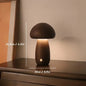 Mushroom-shaped lamp on a surface with measurements indicated