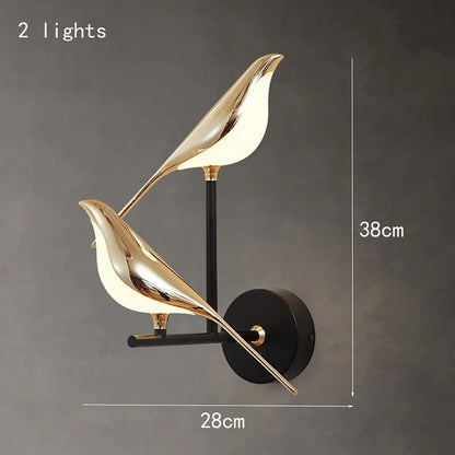 Modern wall lamp with two gold leaf-shaped lights on a gray background