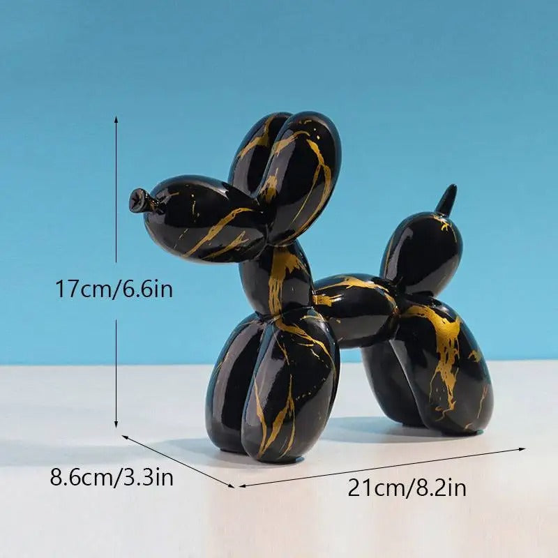 Black and gold balloon dog sculpture with measurements on a blue background